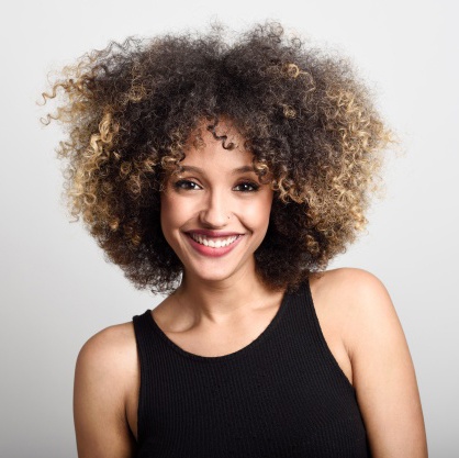 woman-smiling-face-with-curly-hair_1139-582